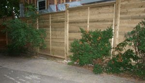 A pressure treated horizontal board fence in Toronto