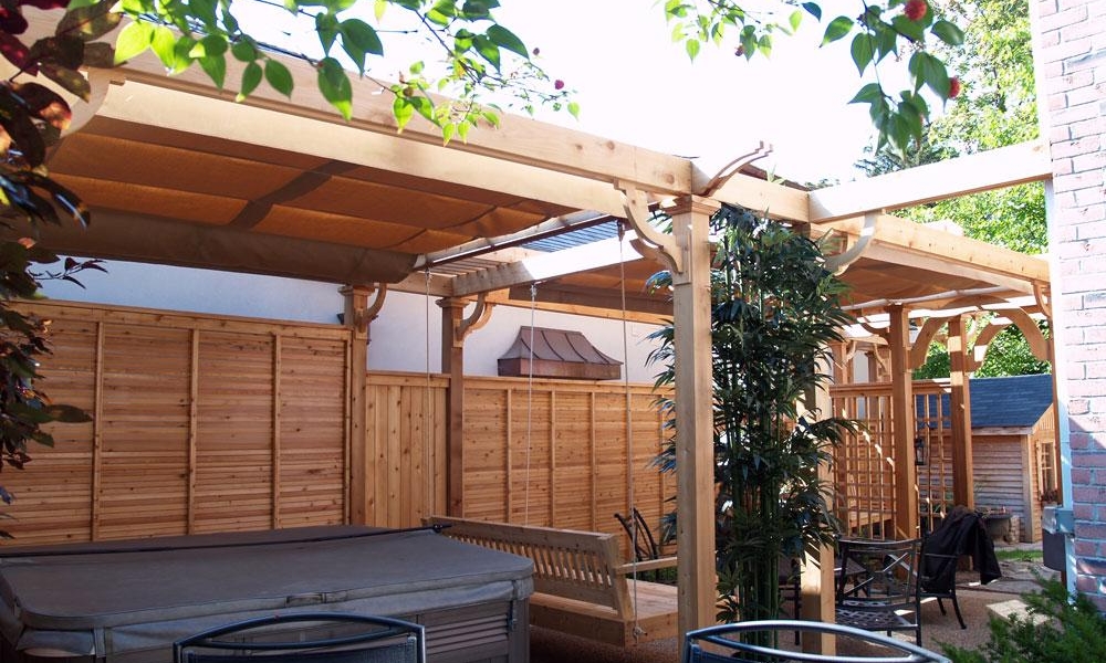 large retractable canopy pergola for privacy from encroaching home