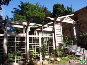 A modern styled pergola, trelliswork fence and arbor with gate in Toronto Ontario