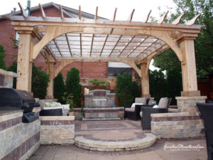 pergola designed to be self supporting atop questionable retaining walls. (Oversized braces make it work)