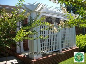 Entrance pergola for client in Kentucky featuring arched beams and trelliswork