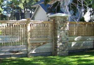 Fence design with Trelliswork featuring stone columns and alternating details. Full Privacy, part privacy, full trelliswork.